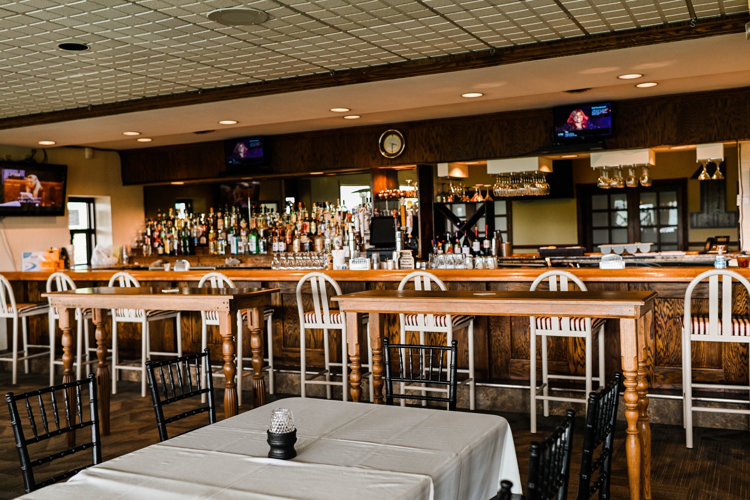 Dining room at 1919 Restaurant & Pub with warm lighting and set tables