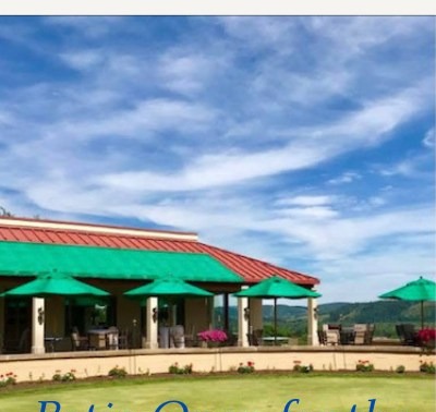 The SVCC patio with umbrellas overlooking the course